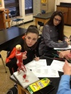 Karns High School students with miniature human muscular figures, part of a purchase made with grant money